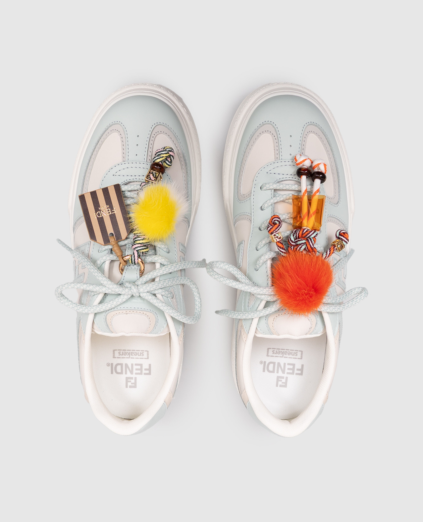 Match white leather sneakers with a pendant Fendi
Match white leather sneakers with a pendant Fendi