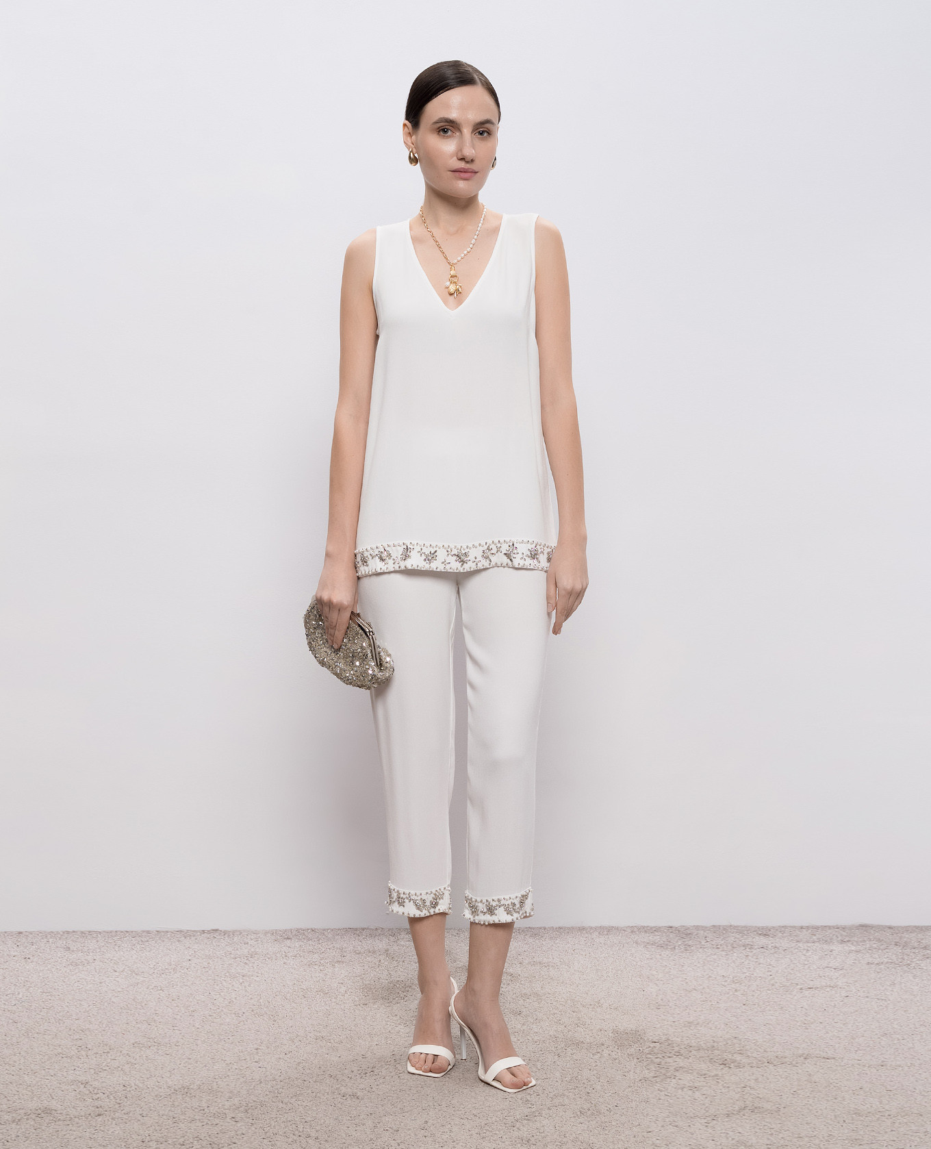 White top with applique Twinset
White top with applique Twinset