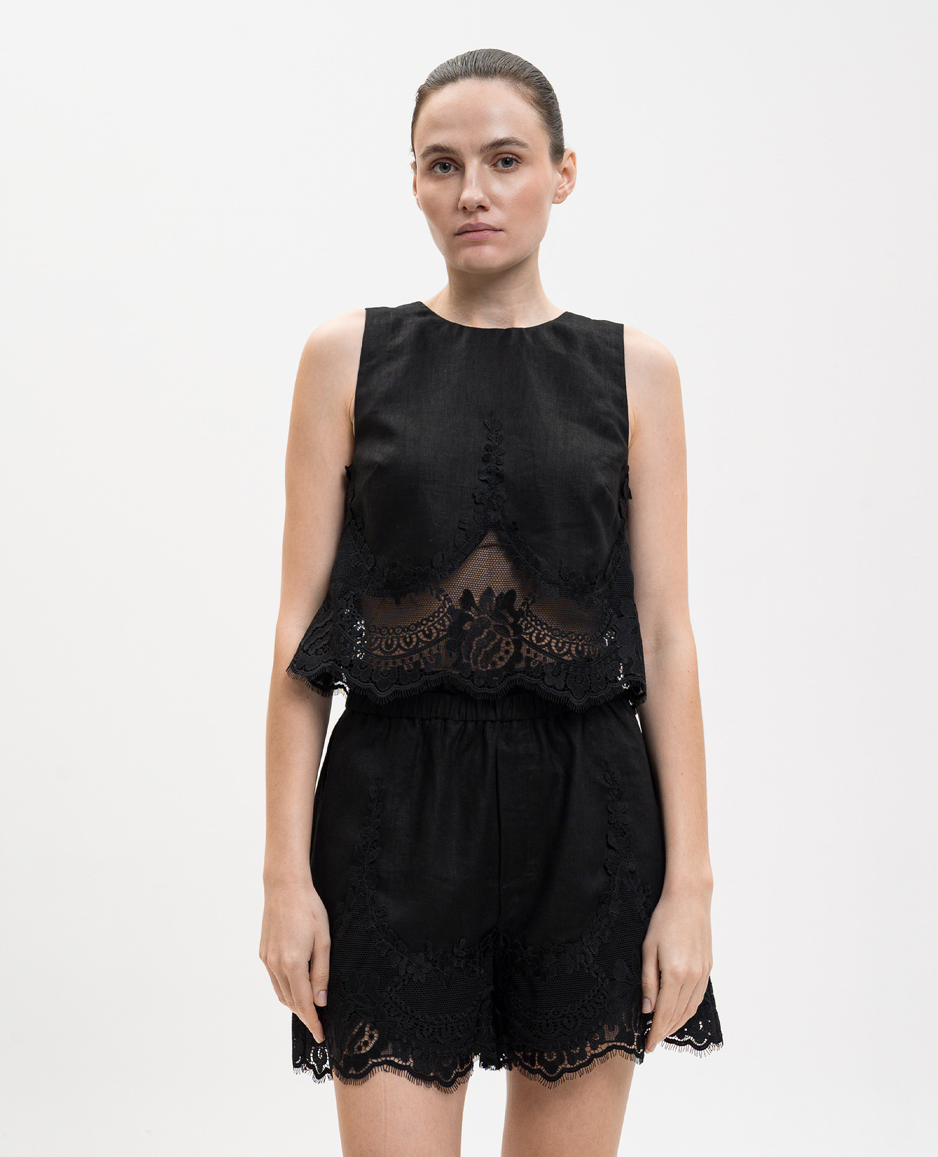 Black linen top with lace Twinset
Black linen top with lace Twinset