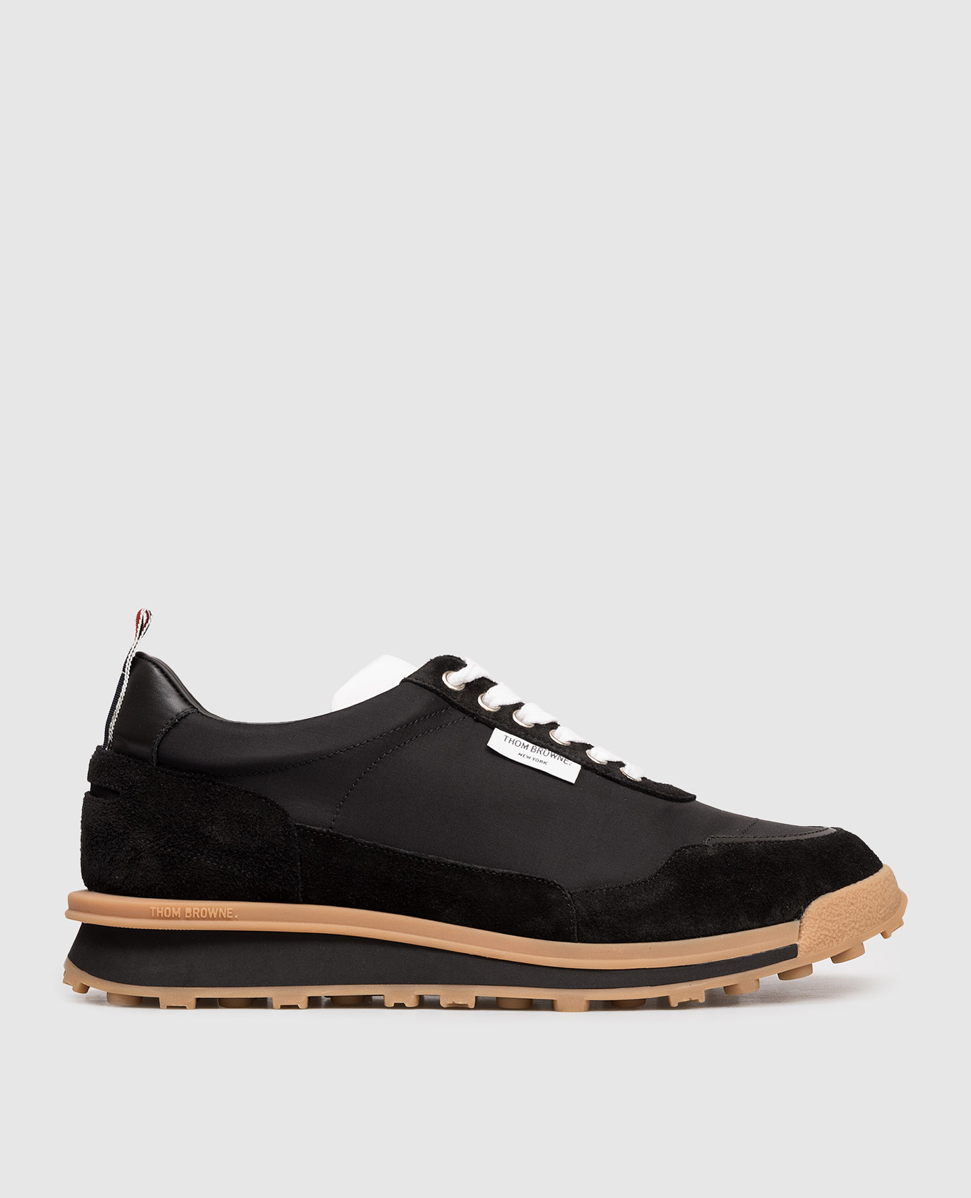 Black combination sneakers with logo Thom Browne
Black combination sneakers with logo Thom Browne