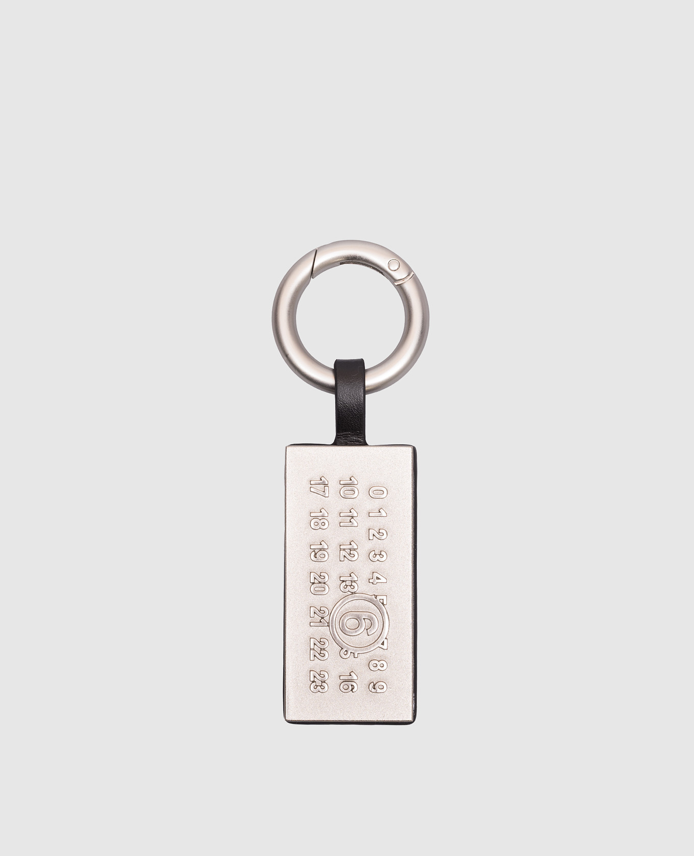 Black leather bag keychain Numeric tag Maison Margiela MM6
Black leather bag keychain Numeric tag Maison Margiela MM6