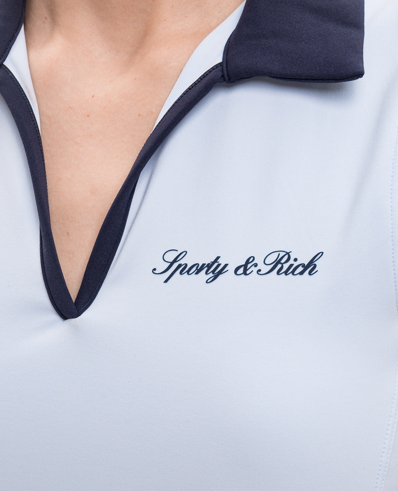 Blue top with polo collar Sporty & Rich, Light blue
Blue top with polo collar Sporty & Rich, Light blue