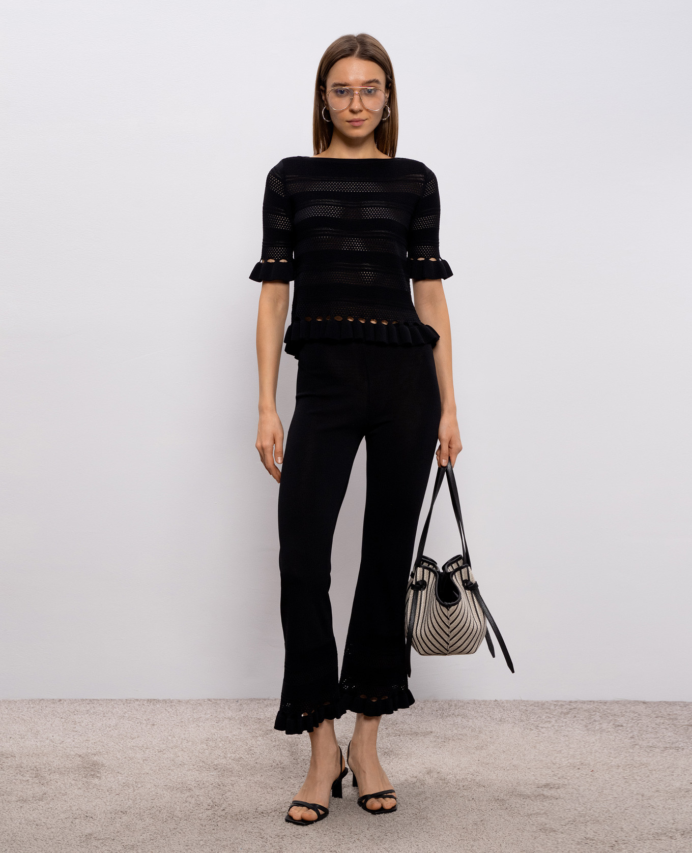 Black pants with ruffles Twinset
Black pants with ruffles Twinset