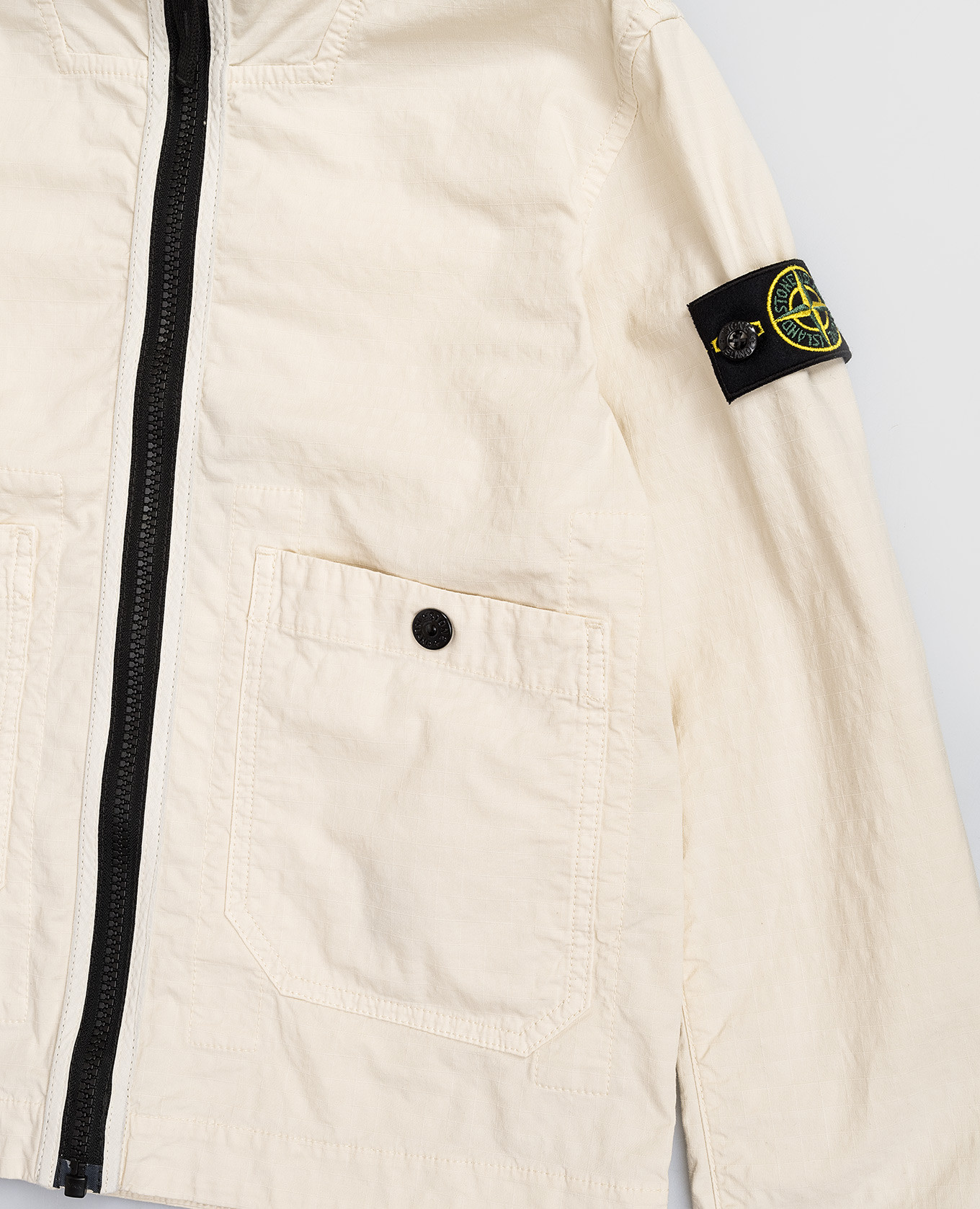 Children's beige jacket with logo patch Stone Island
Children's beige jacket with logo patch Stone Island