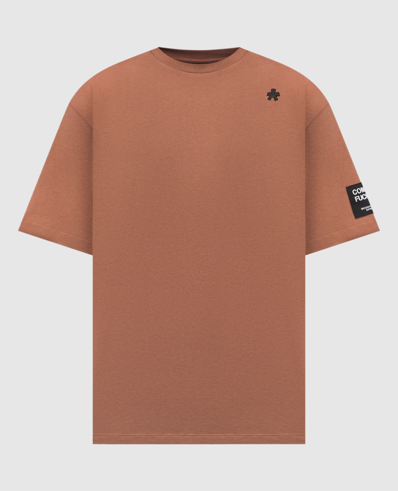 Brown T-shirt with embroidered emblem Comme des Fuckdown
Brown T-shirt with embroidered emblem Comme des Fuckdown