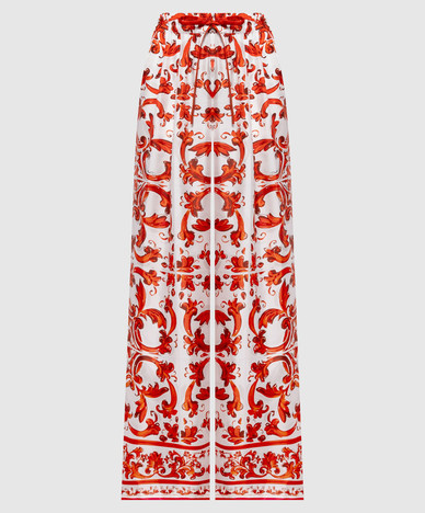 White silk pants with branded print
