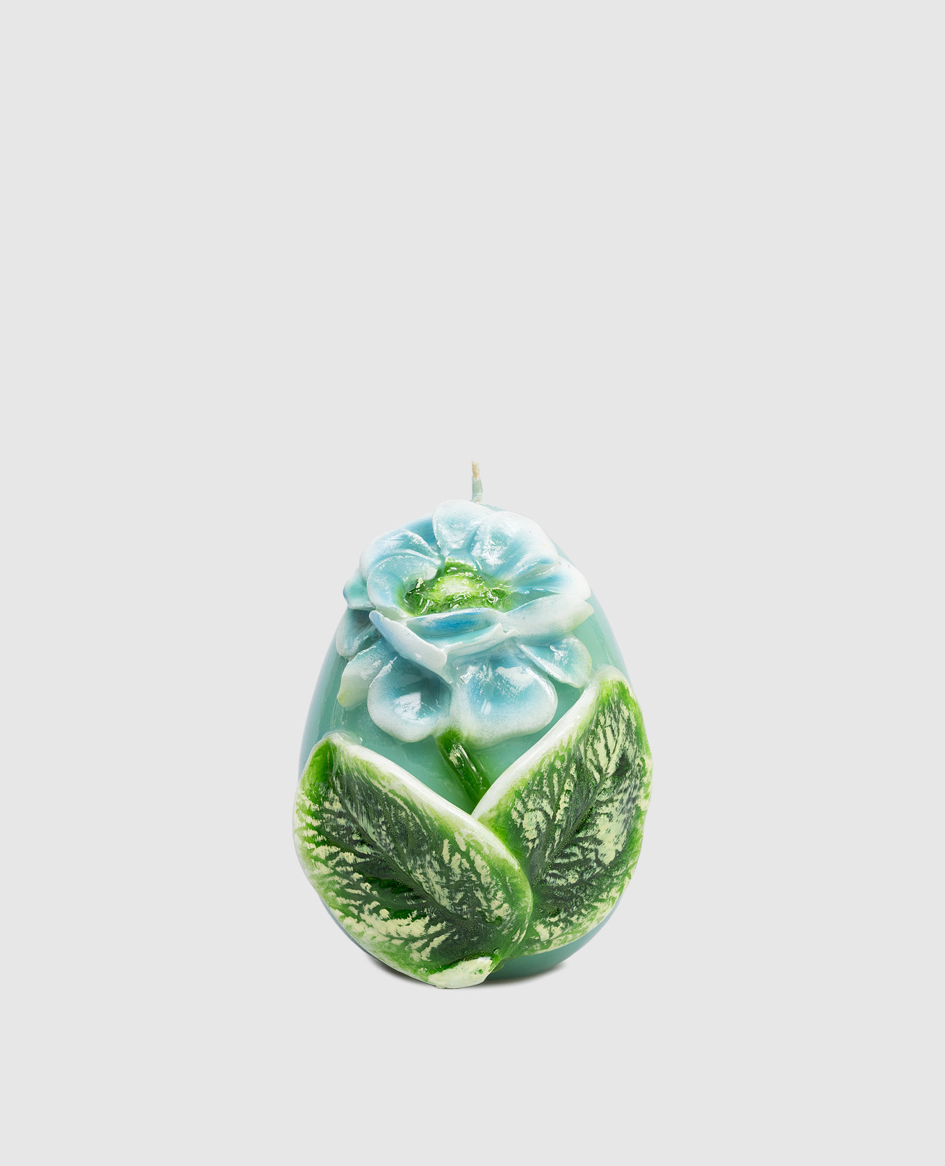 

Blue egg-shaped candle with peony Cereria Introna