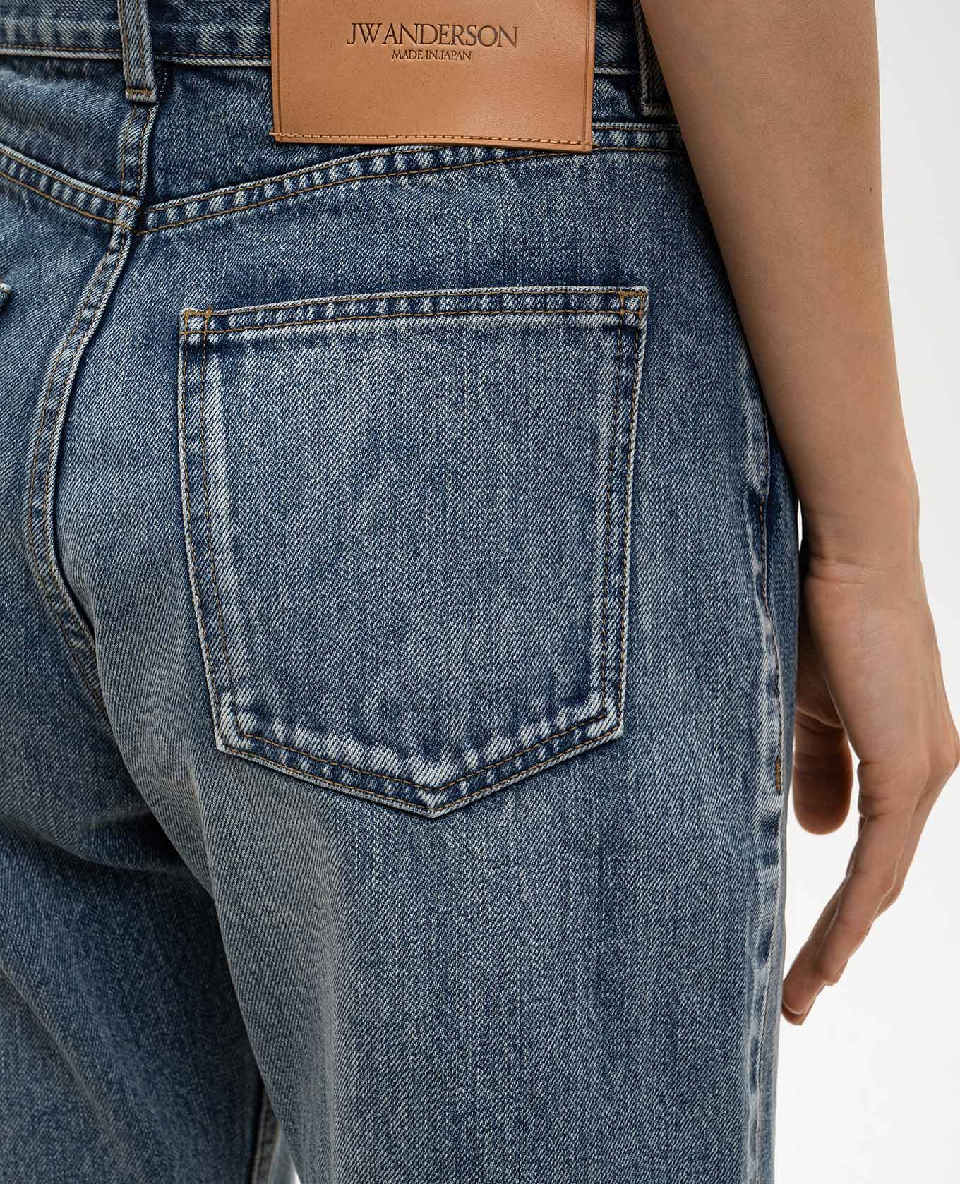 Blue jeans with a worn effect JW Anderson 5