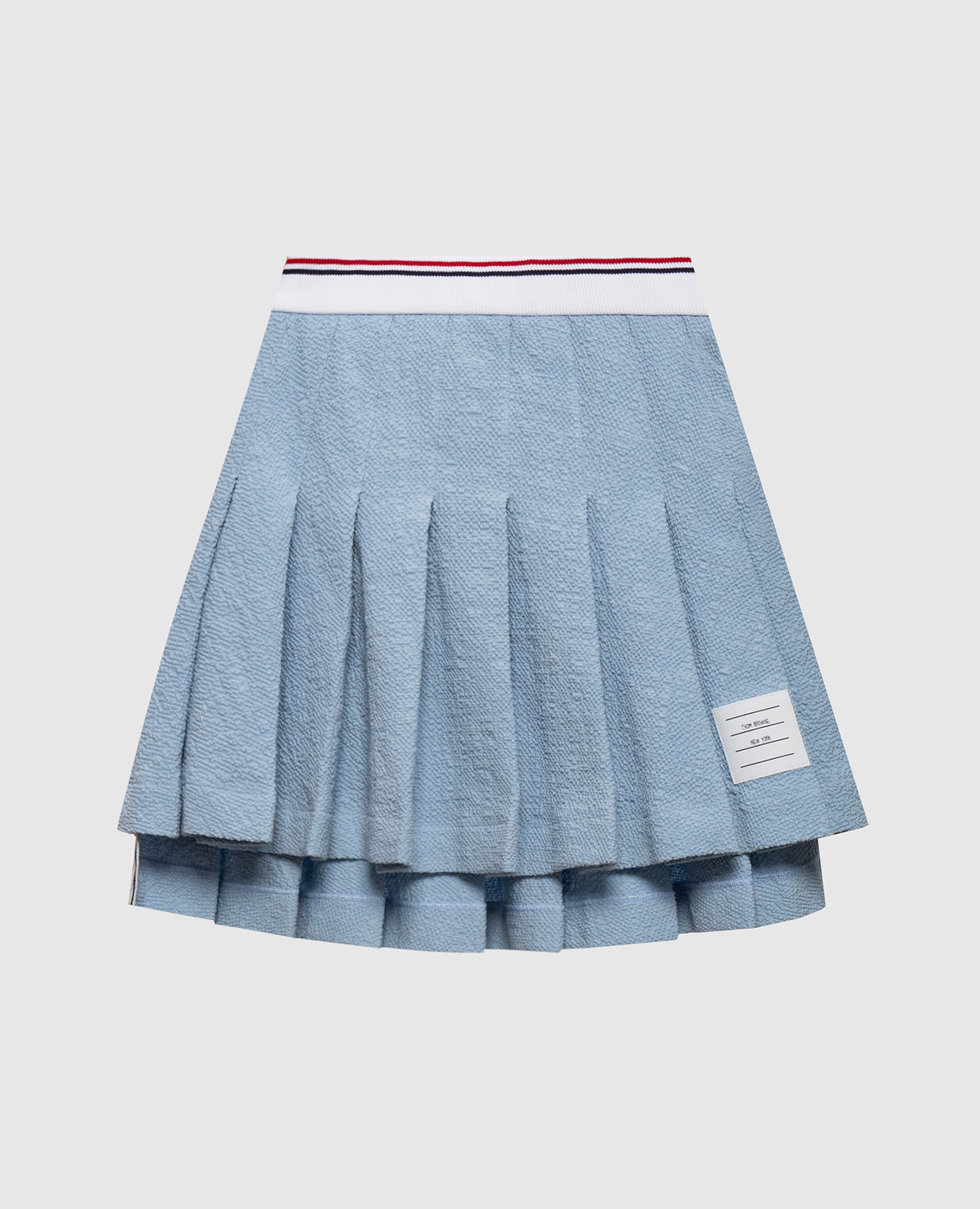 Blue pleated skirt with logo patch