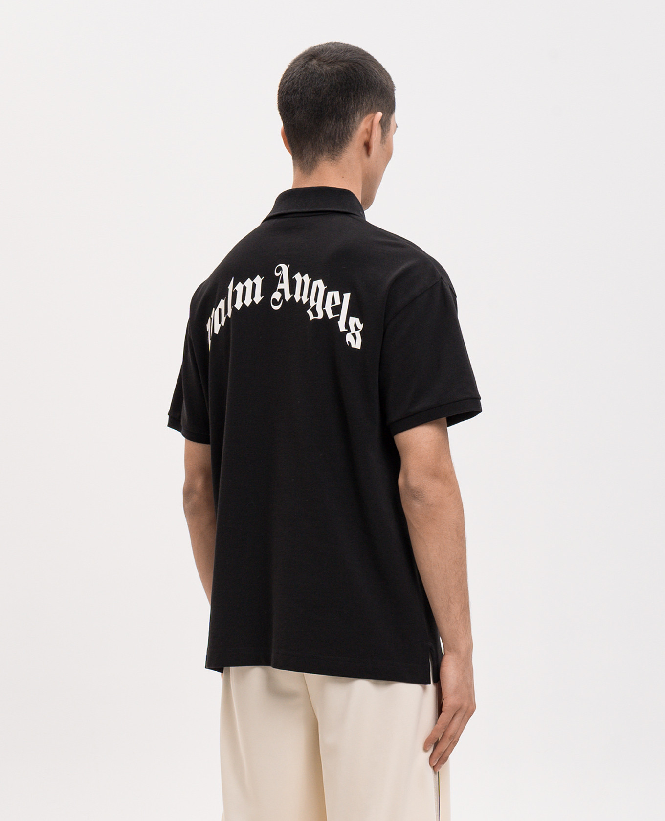 

Black polo shirt with contrast logo print Palm Angels