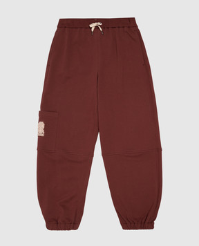 Brunello Cucinelli Children's burgundy joggers with textured emblem BN05NE473B