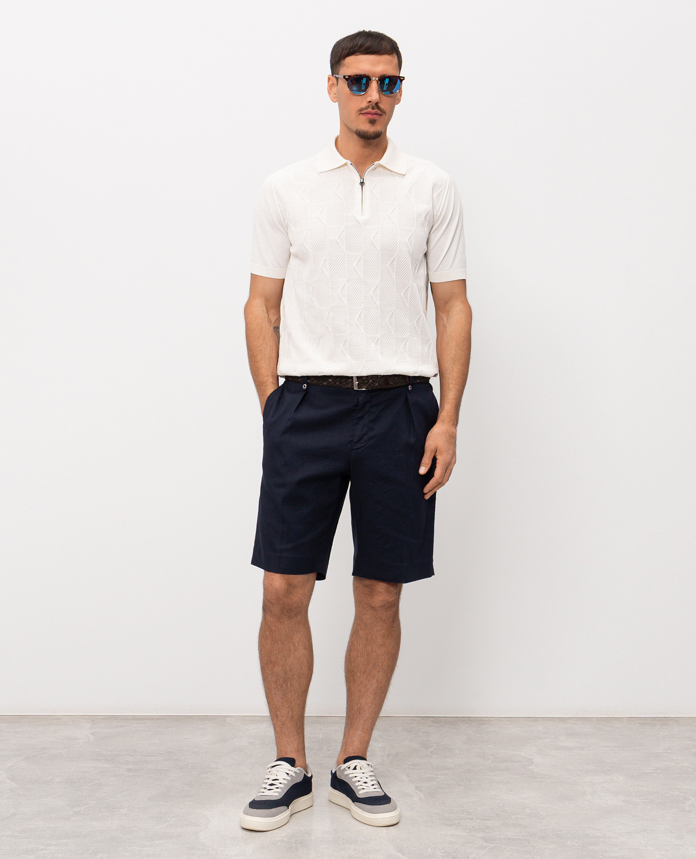 

White polo shirt with a pattern and an emblem Stefano Ricci