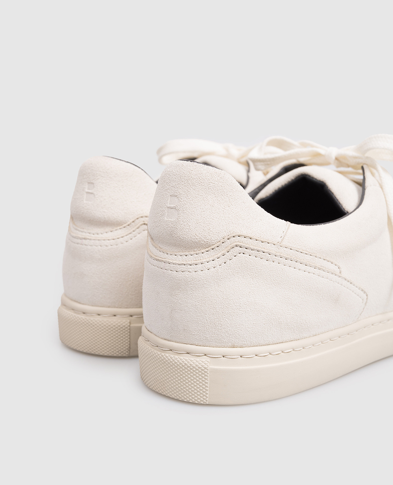 

White suede sneakers with emblem Brett Johnson
