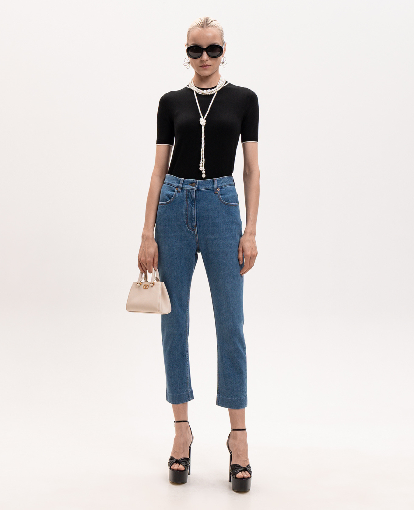 

Blue cropped jeans with logo patch Valentino