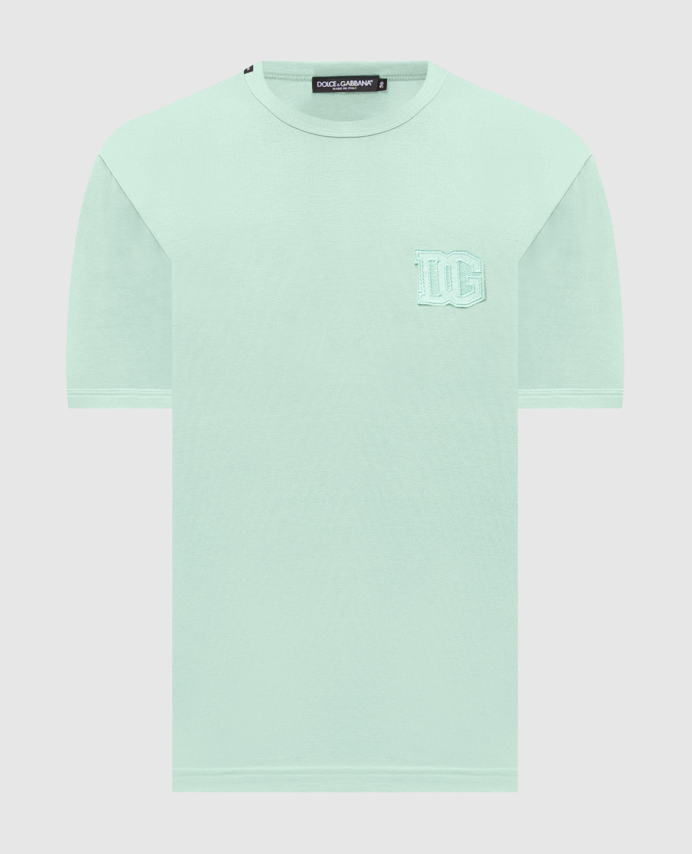 Green t-shirt with a monogram patch