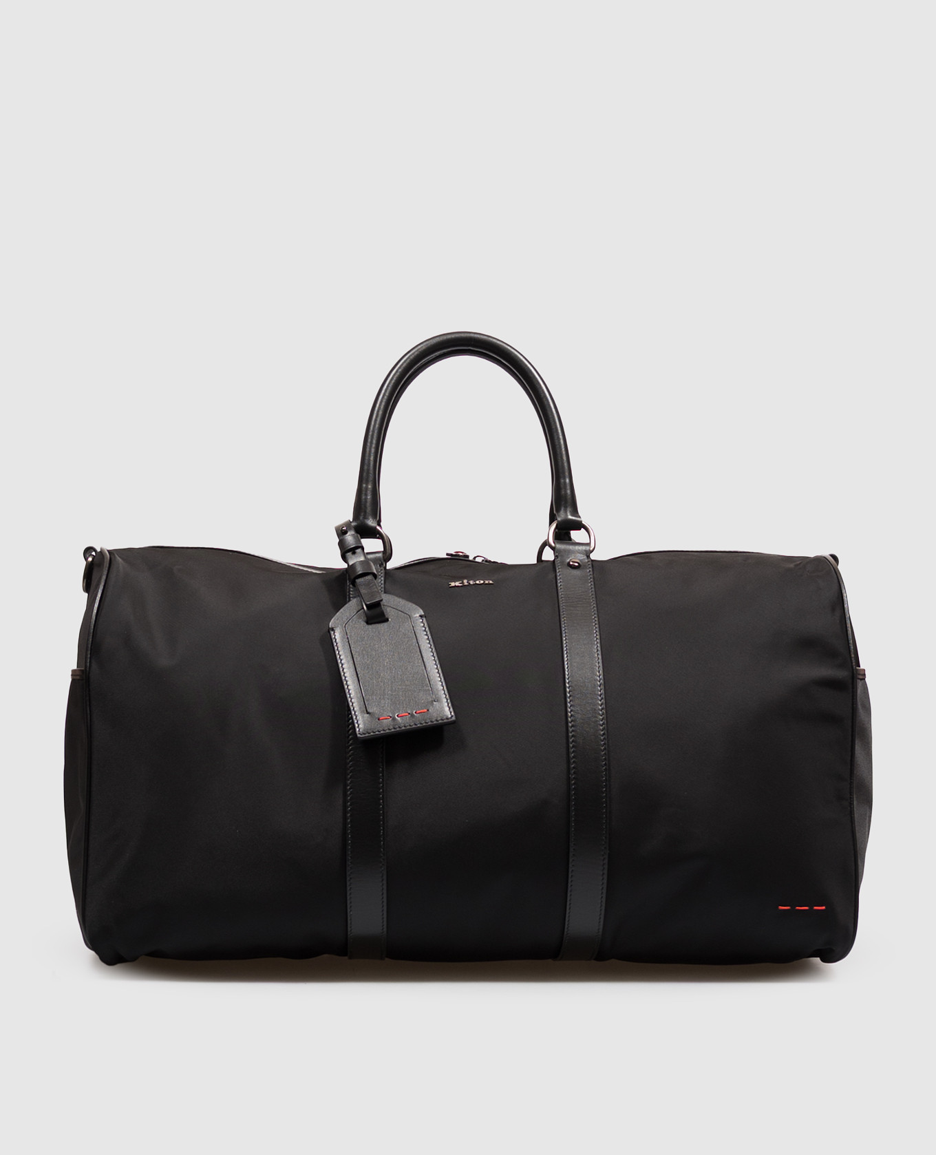 Black travel bag with metal logo
