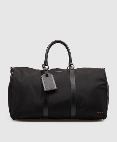Black travel bag with metal logo