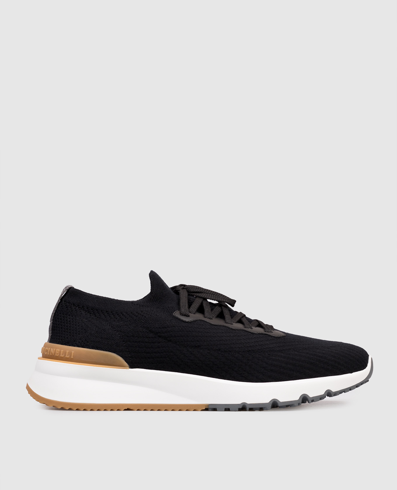 Black sneakers with textured logo