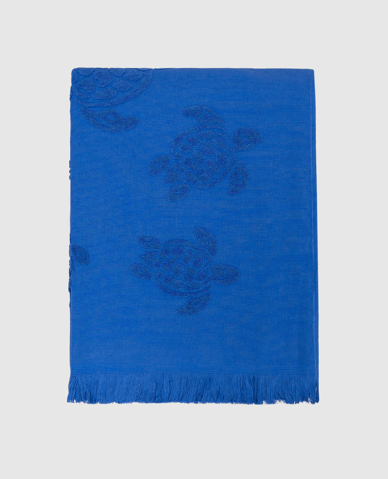 Blue terry beach towel with fringe pattern