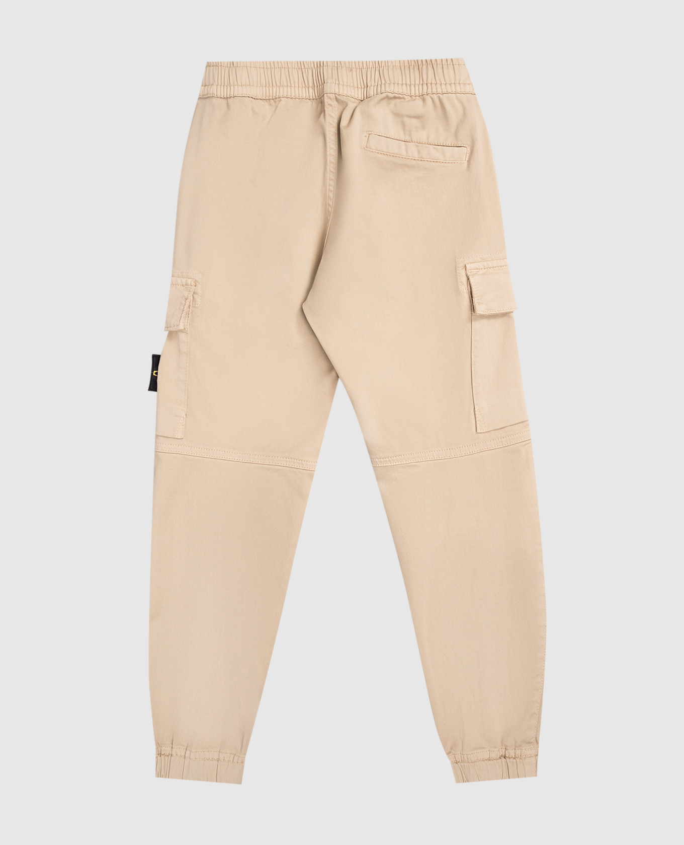 

Children's beige joggers with logo Stone Island