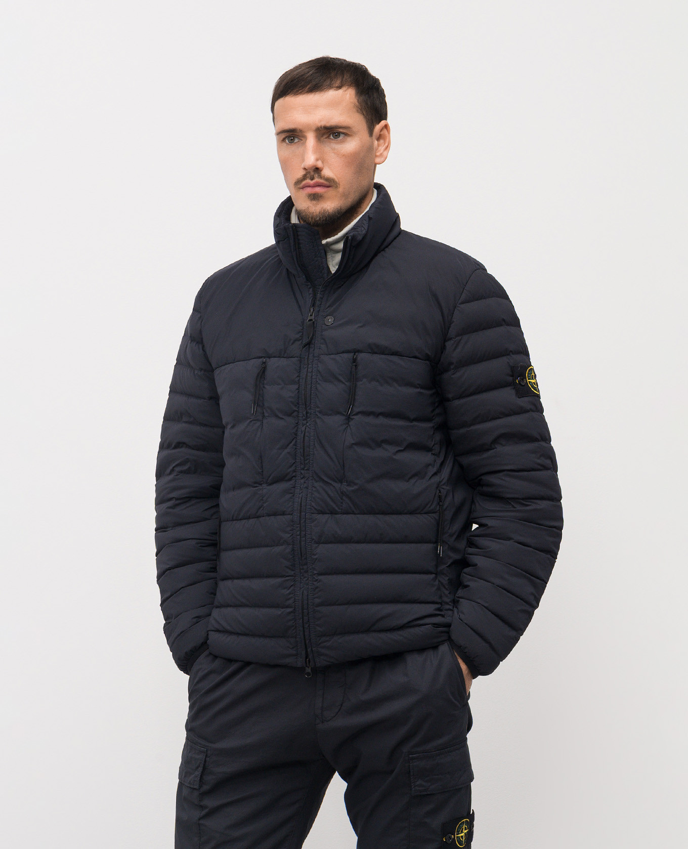 

Blue quilted down jacket with logo Stone Island