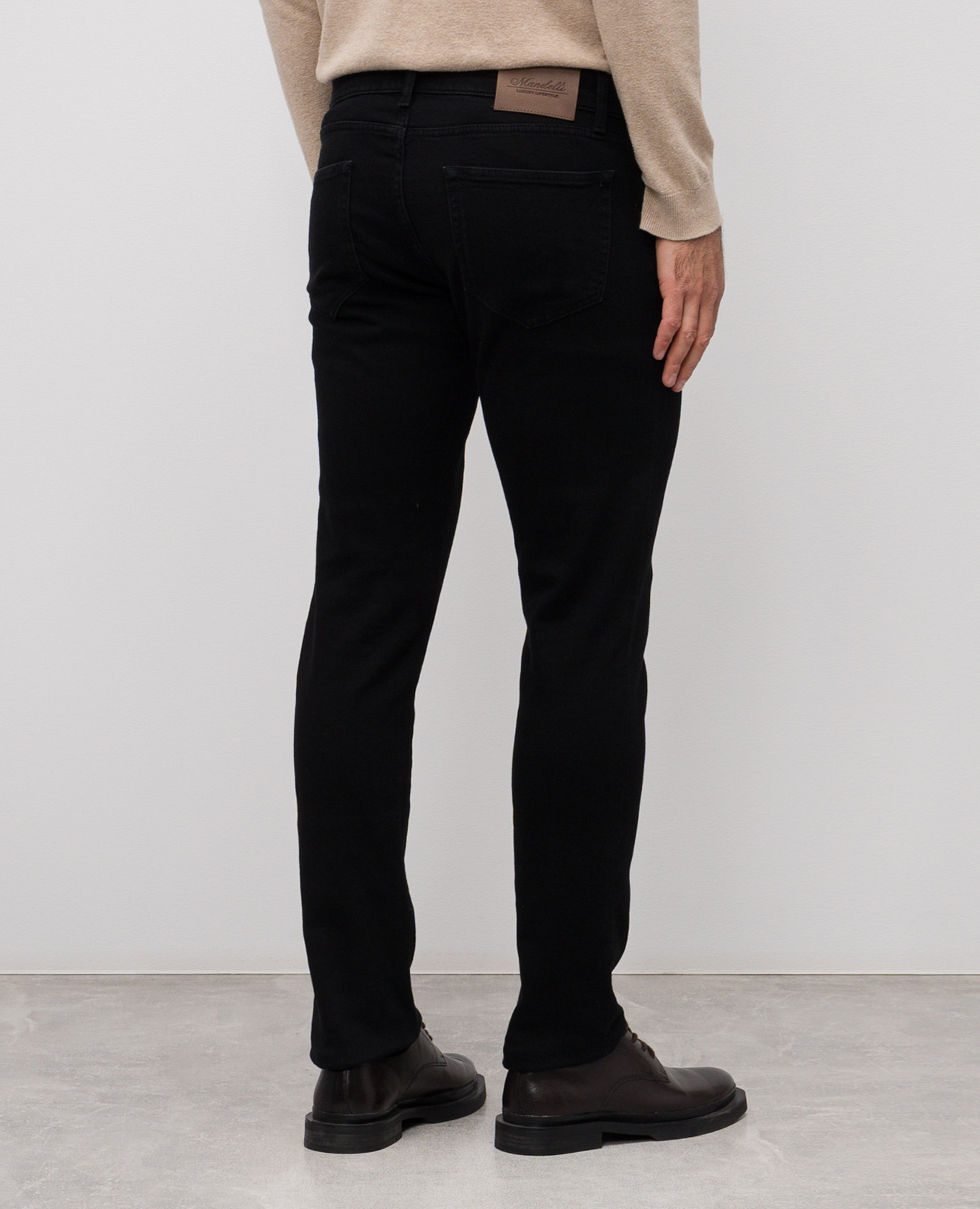 Black jeans with logo patch Enrico Mandelli 4