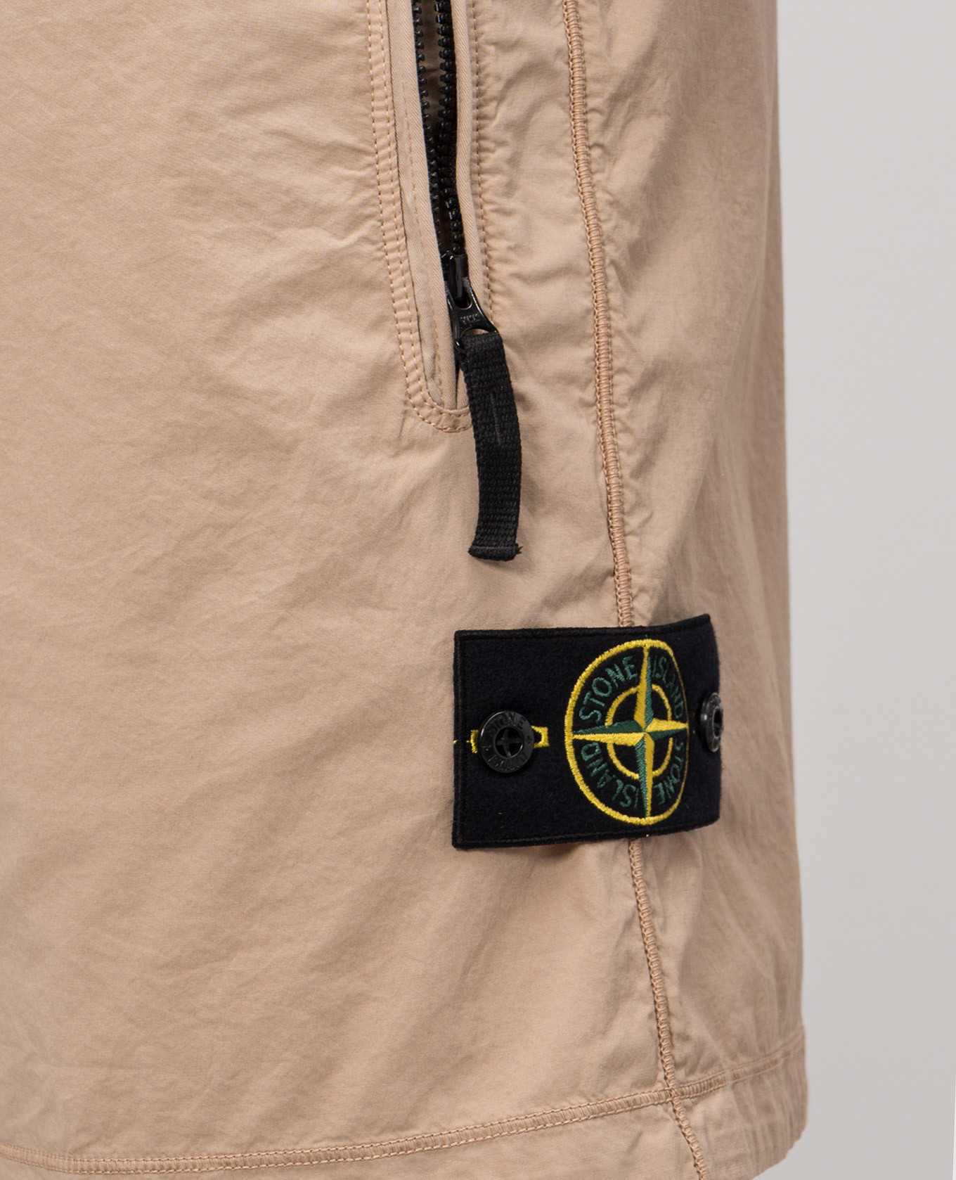 

Beige shorts with logo patch Stone Island