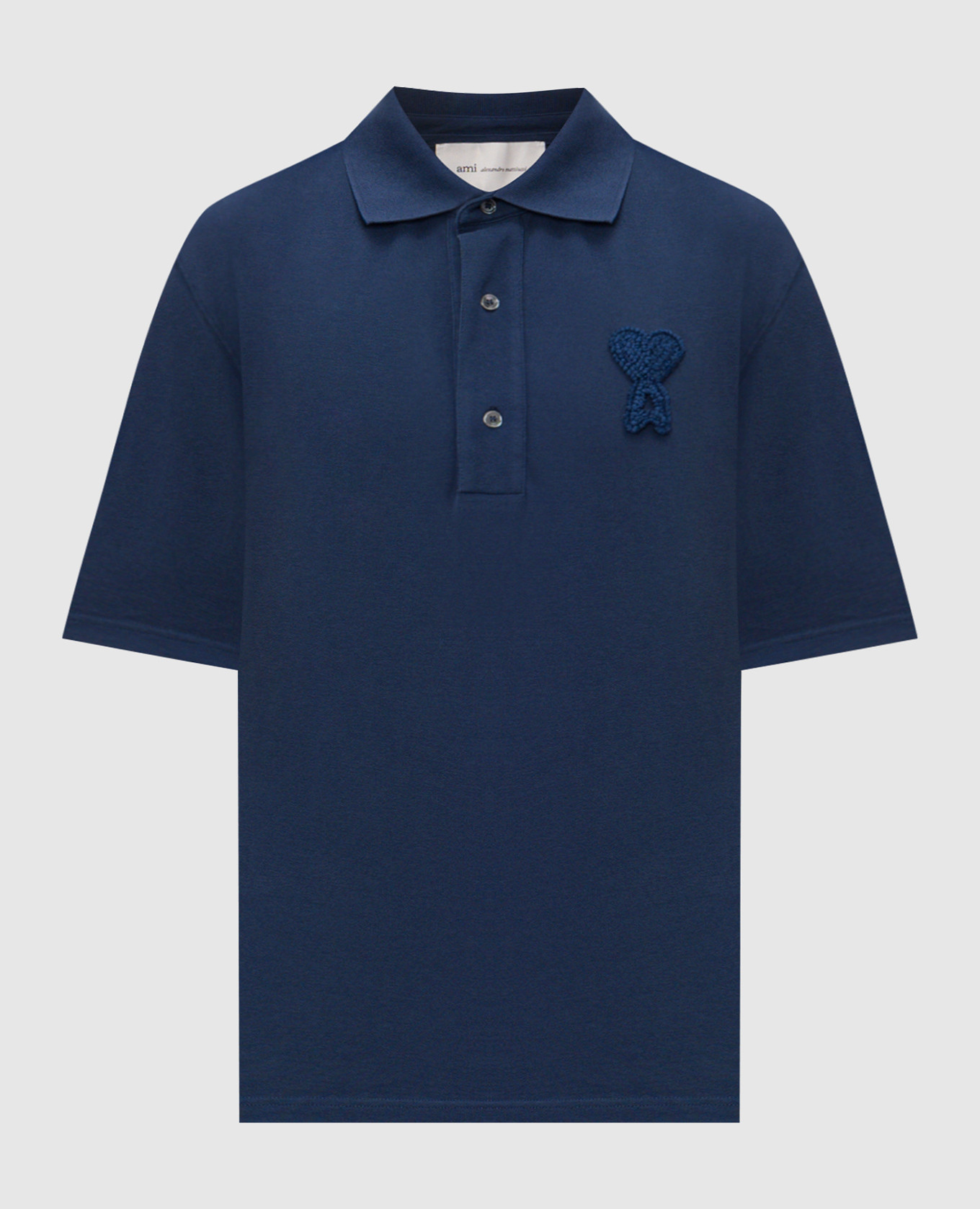 Blue polo with textured logo patch