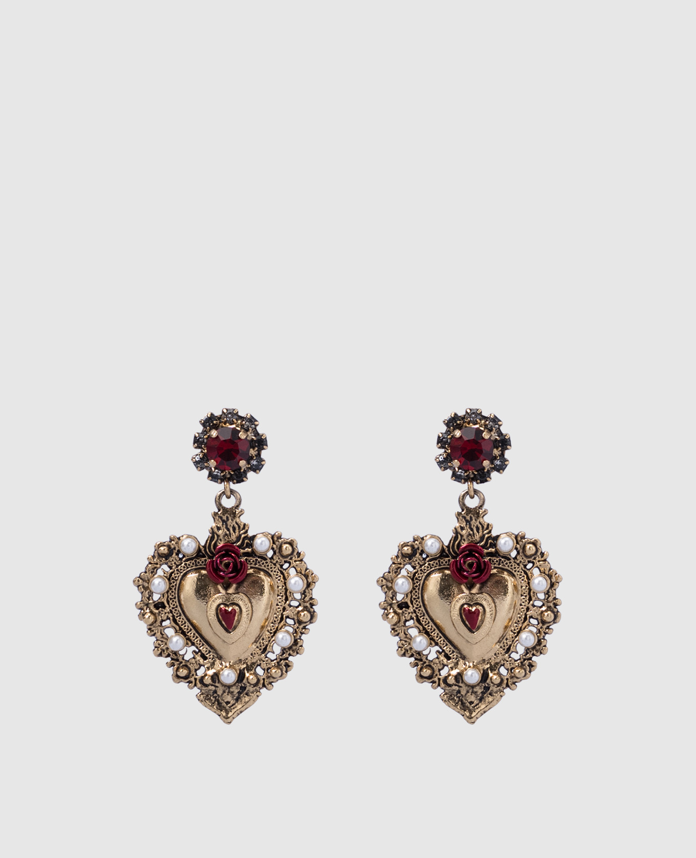 Gold earrings with heart-shaped pendants