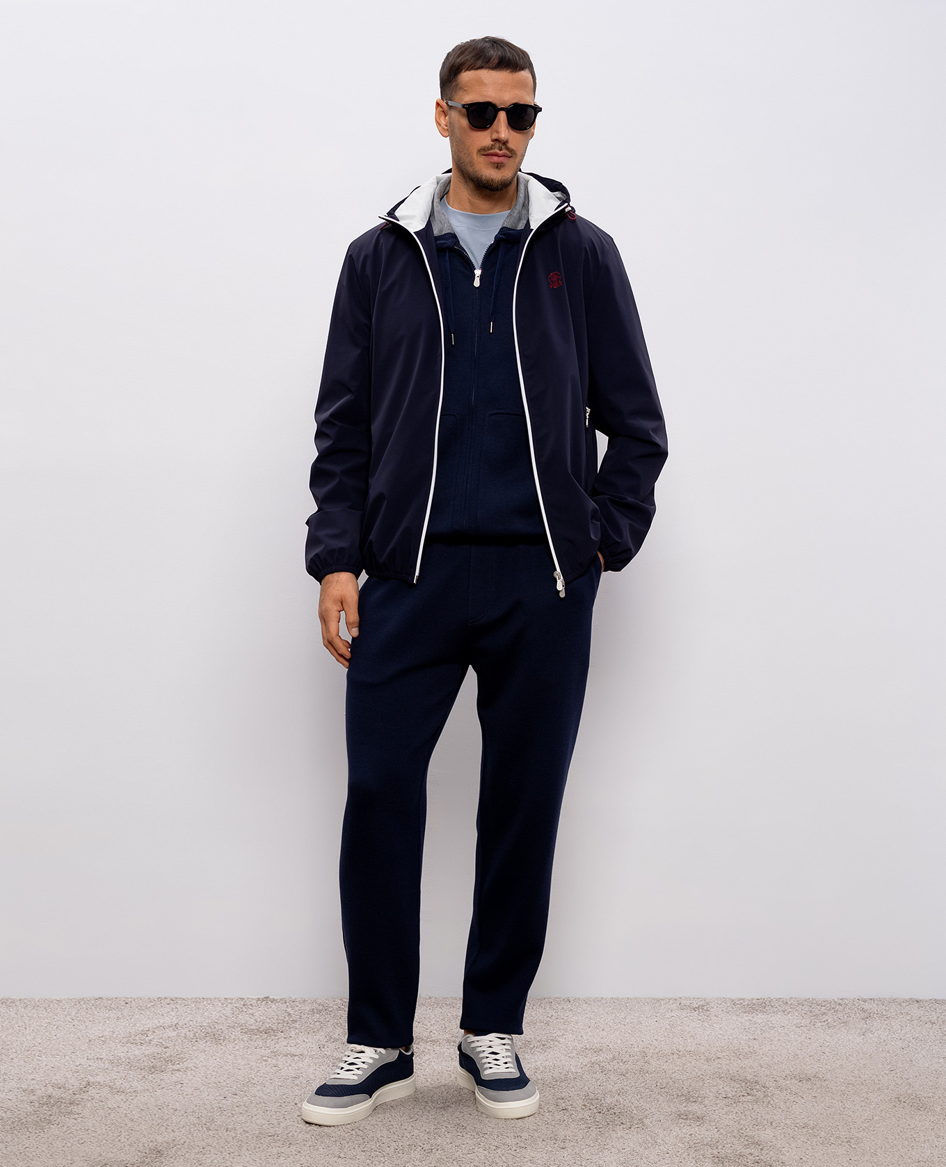 

Blue windbreaker with embroidered emblem Brunello Cucinelli