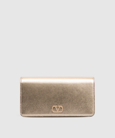 Golden leather bag with Swarovski crystal emblem