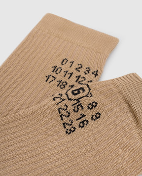Maison Margiela MM6 Beige knee-high socks with emblem pattern S52TL0038M13244