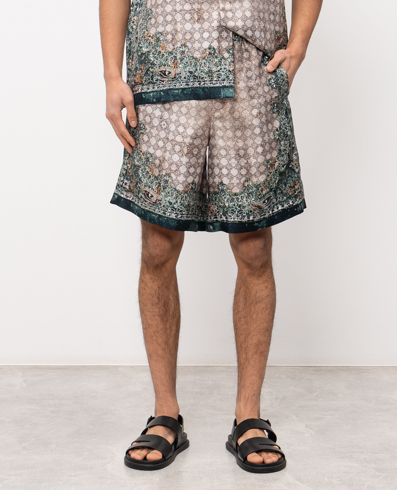 

Beige silk shorts with branded print AMIRI