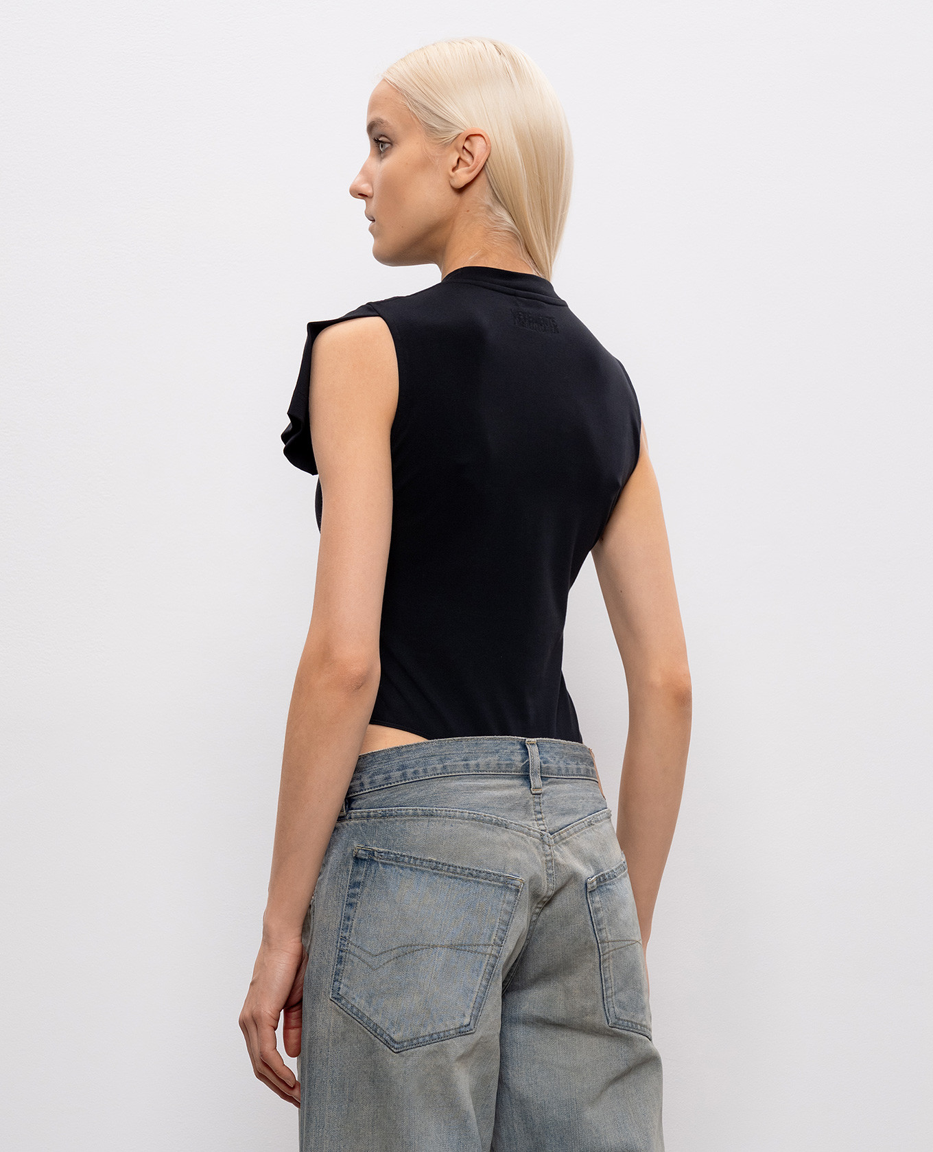 

Black bodysuit with brand patch Vetements