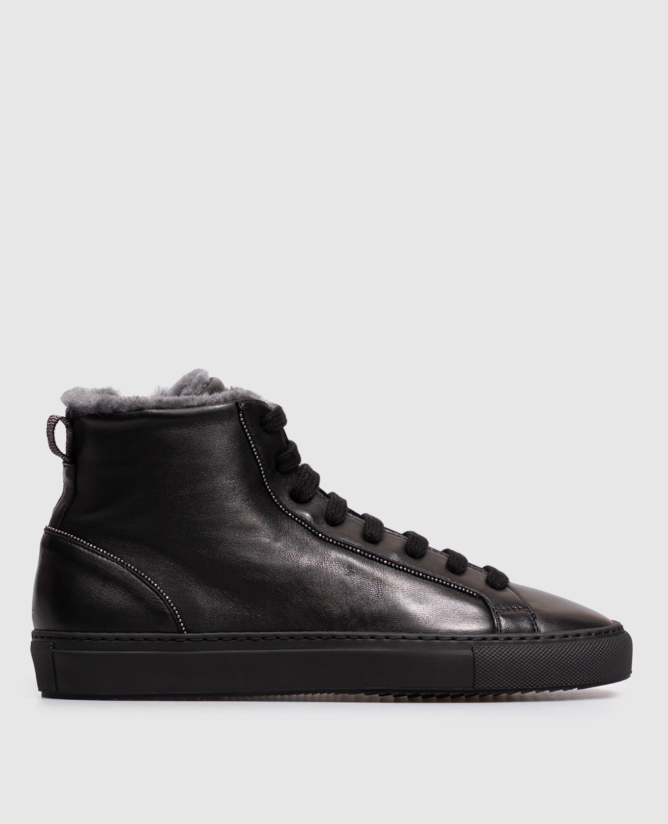 Black leather high-tops with fur and a monil chain