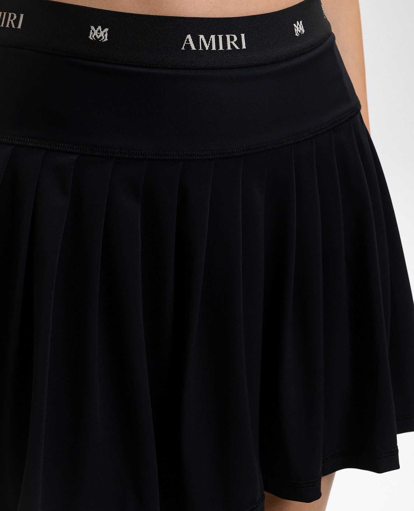 

Black pleated skirt with logo AMIRI