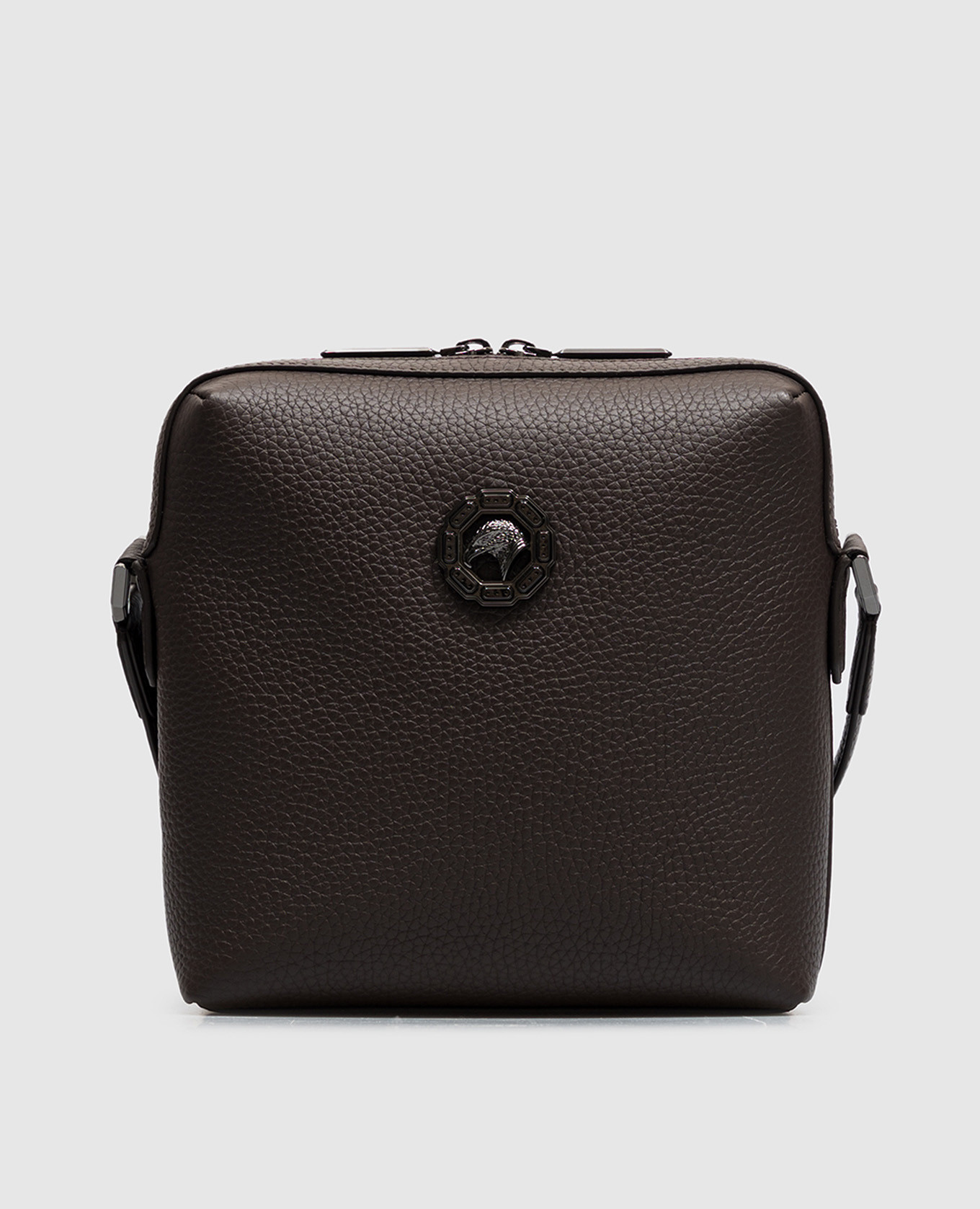 Brown leather bag with textured emblem