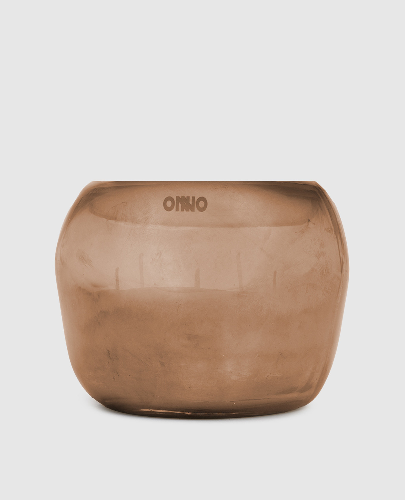 

Cape Copper  candle with Zanzibar scent in a glass candle holder Onno, Brown