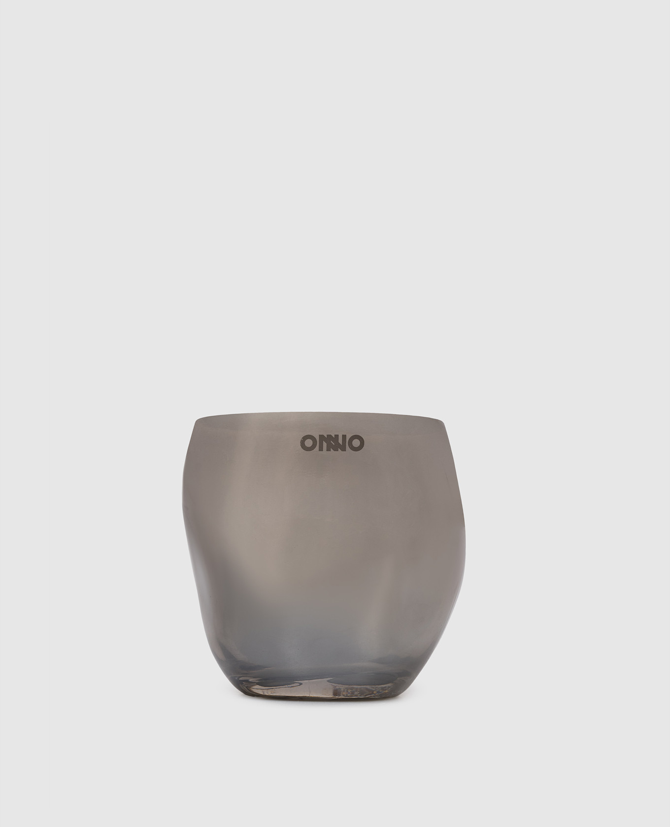 

Cape Smoked Grey  candle with Muse scent in a glass candle holder Onno, Silver