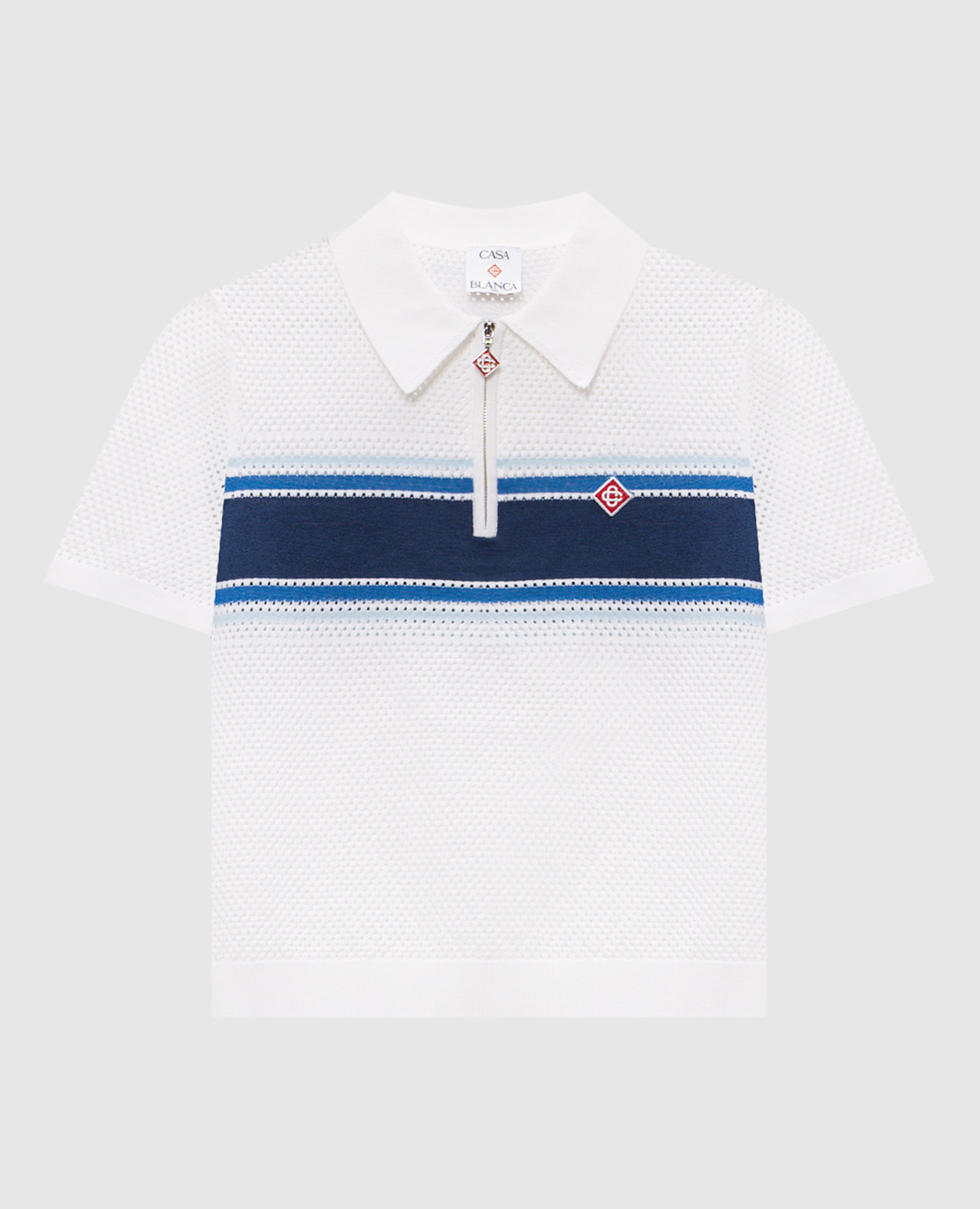Witte polo met opengewerkt patroon van wol.