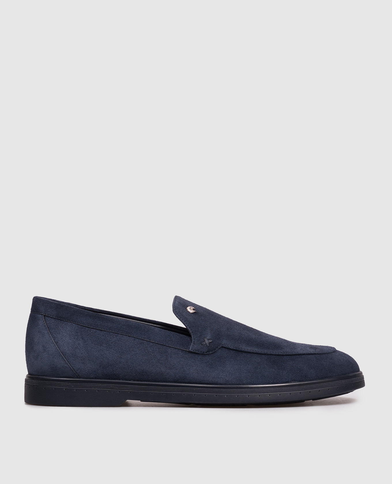 Blue suede loafers with textured emblem