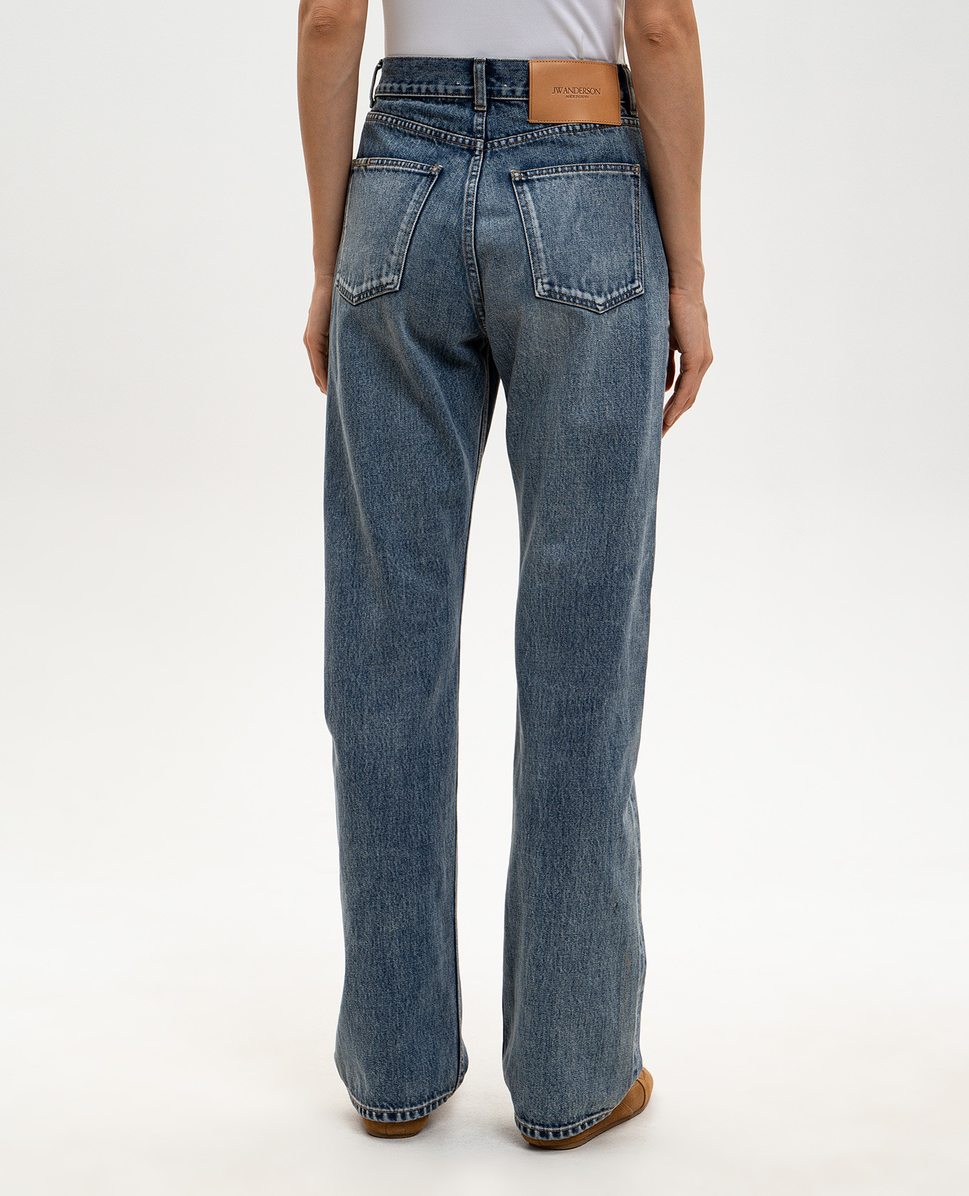 Blue jeans with a worn effect JW Anderson 4