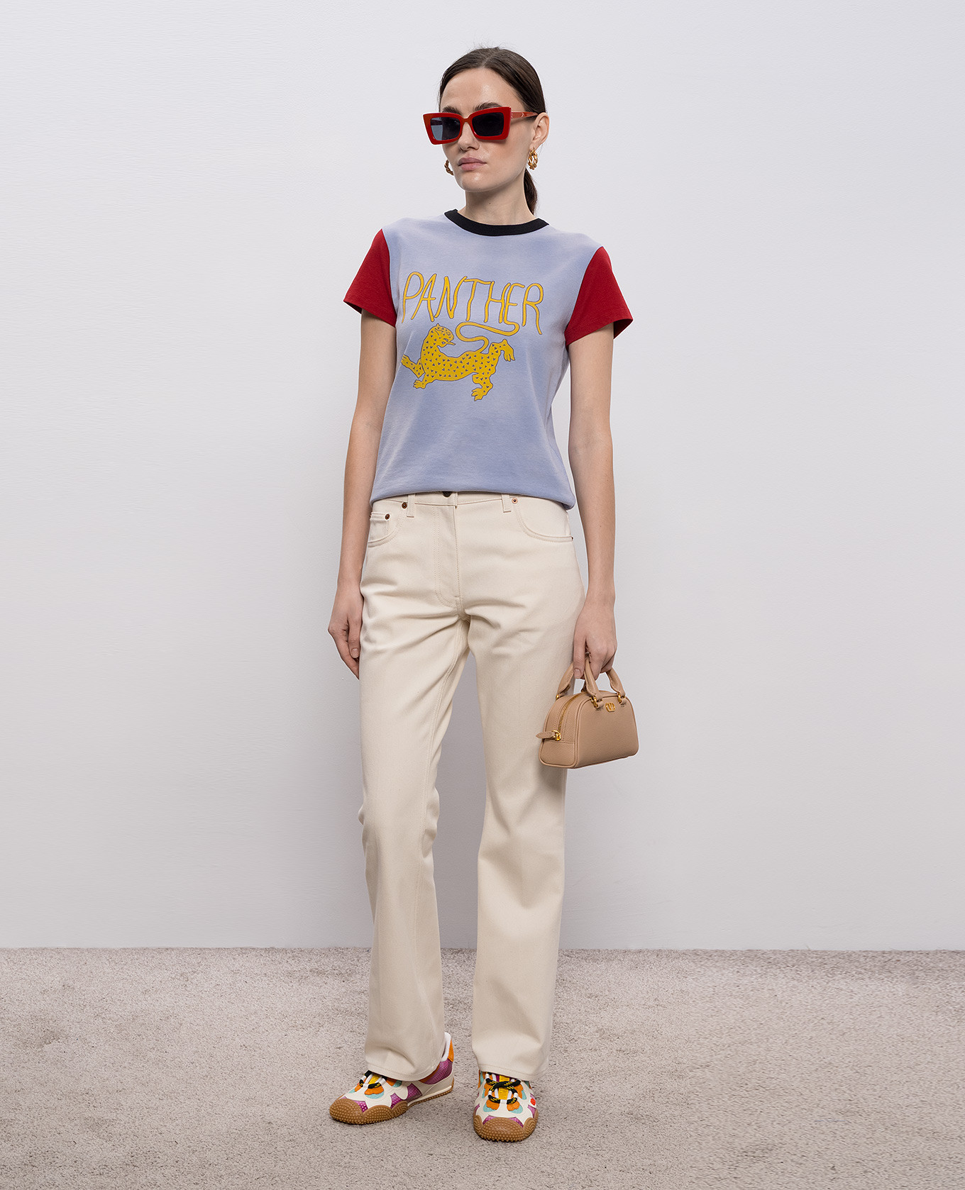 

Beige flared jeans with logo patch Valentino