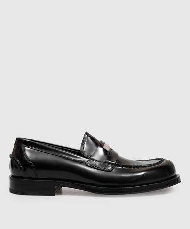 Glanzende zwarte leren loafers met monoframe