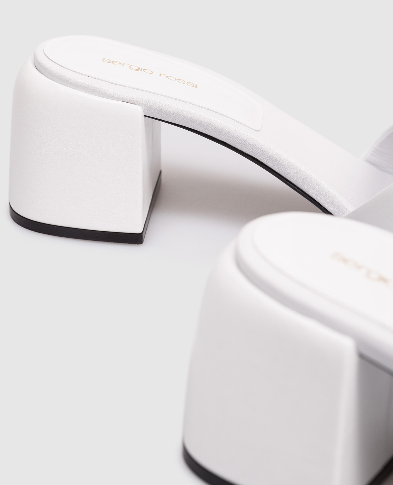 

Surge white leather mules with textured monogram Sergio Rossi