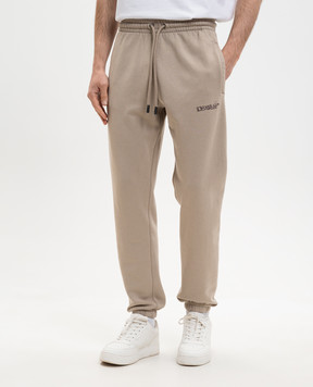 Off-White Beige joggers with logo print 44MCH057S26F001