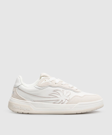 Zapatillas blancas combinadas con emblema bordado