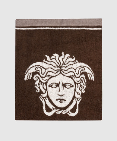 Brown terry towel with Medusa emblem pattern