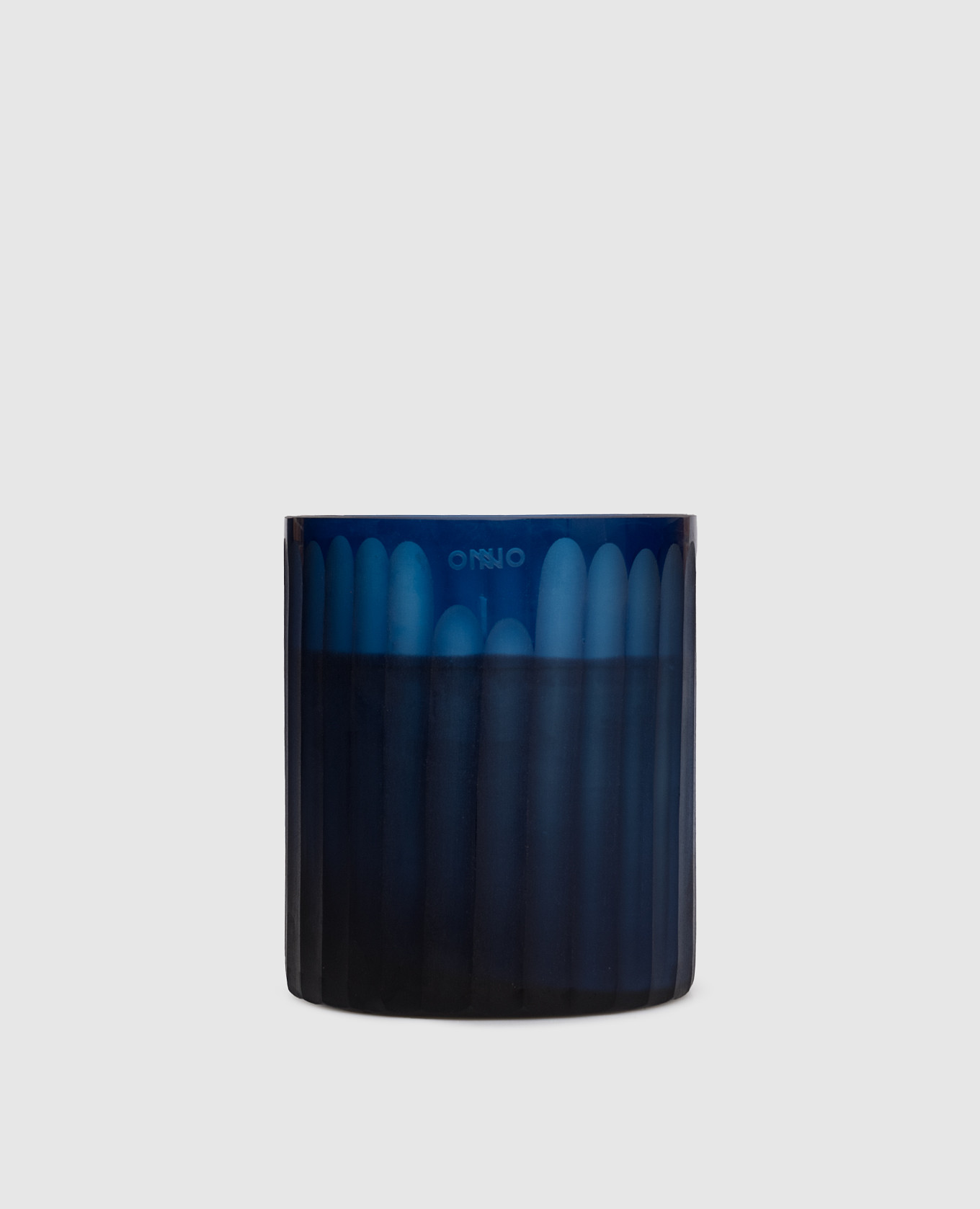 

Royal Blue  candle with Ginger Fig scent in a glass candle holder Onno