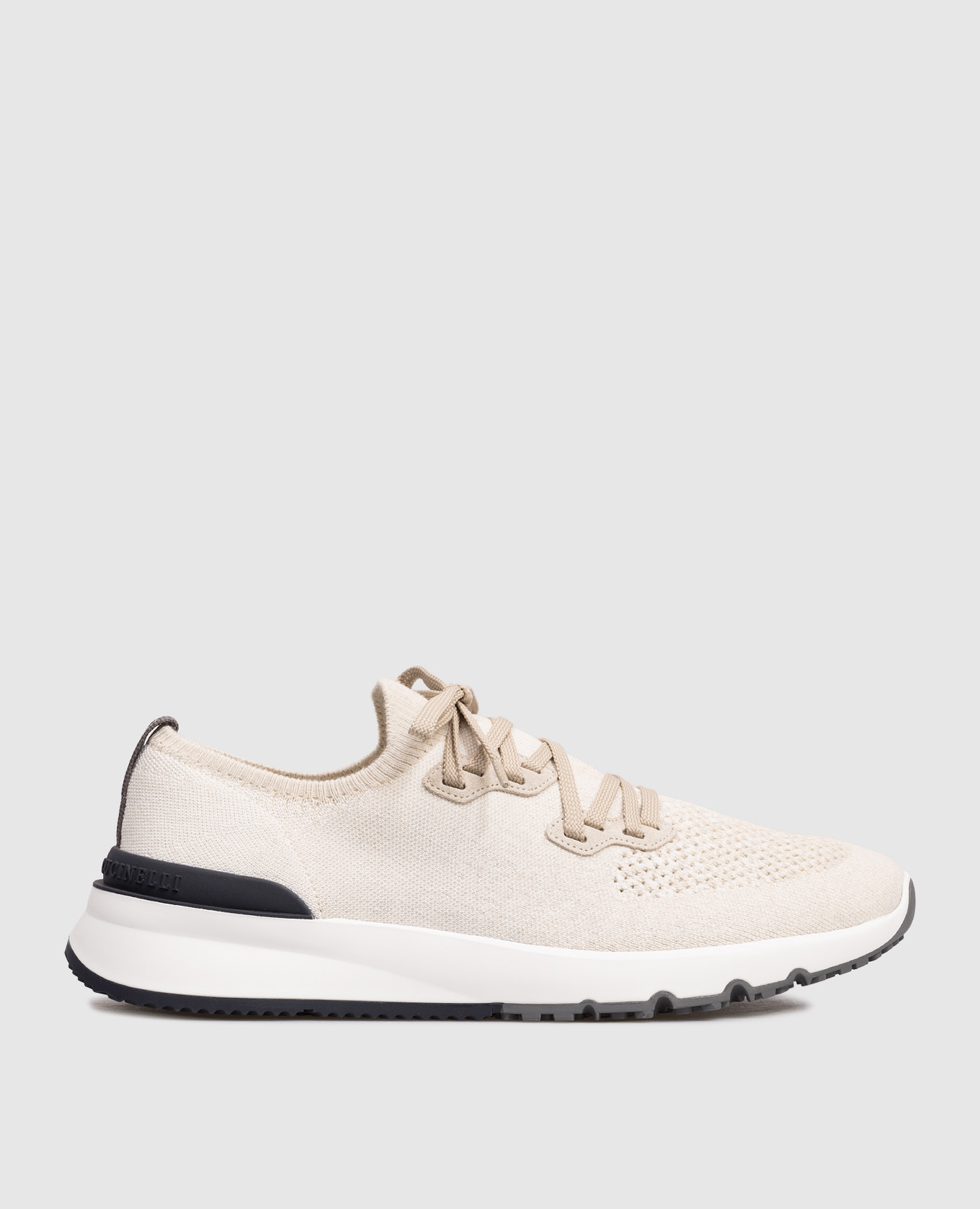 Beige sneakers with textured logo